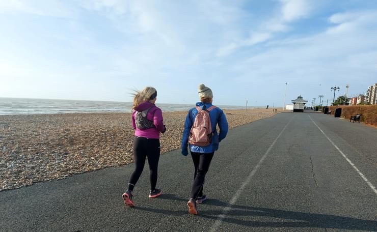 Two women from our Worthing running group on the seafront running together