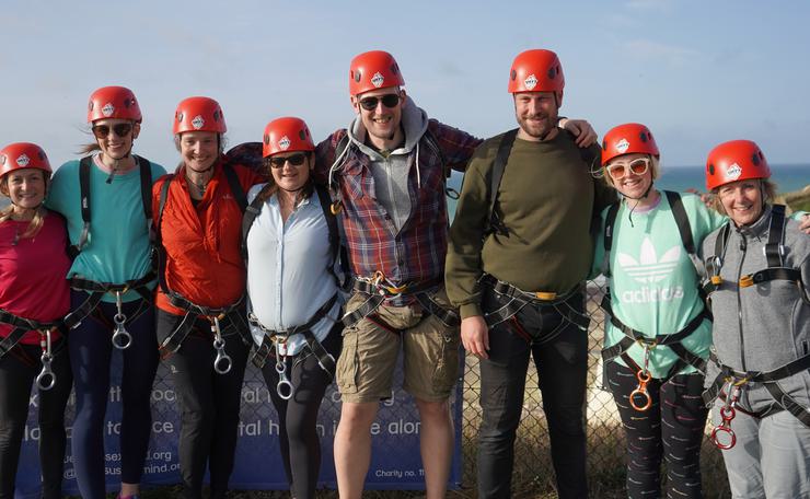Group of charity fundraisers after abseil for mental health