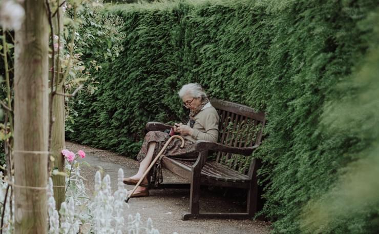 Older lady sitting on a bench