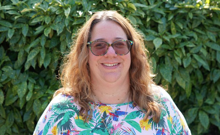 Leanne Head of Mental Health Services outside with a background of greenery