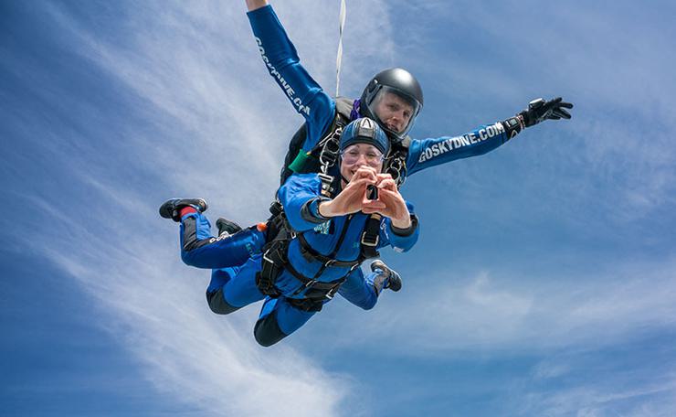 A woman skydiving with an instructor